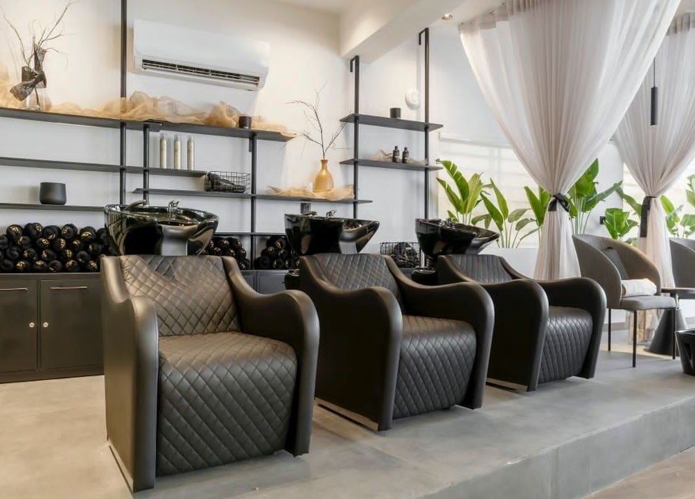 Chic salon interior at My Extensionz, Lagos, NG, featuring luxurious seating and stylish decor.