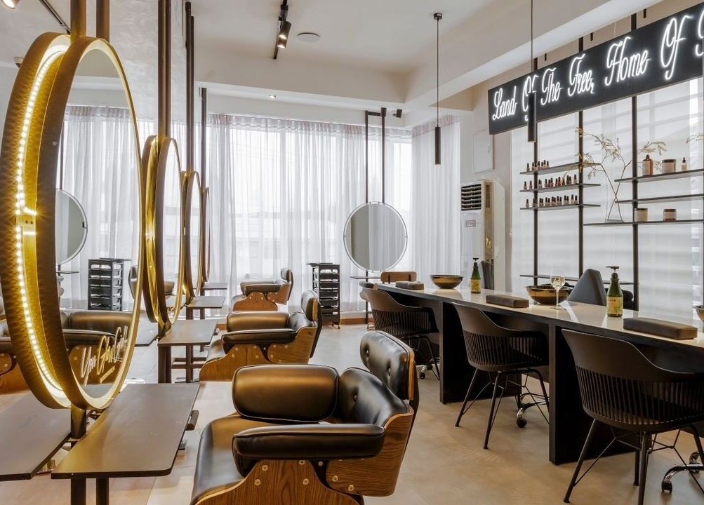 Elegant beauty salon interior at My Extensionz, Lagos, Lagos, NG, featuring luxurious seating and warm lighting.