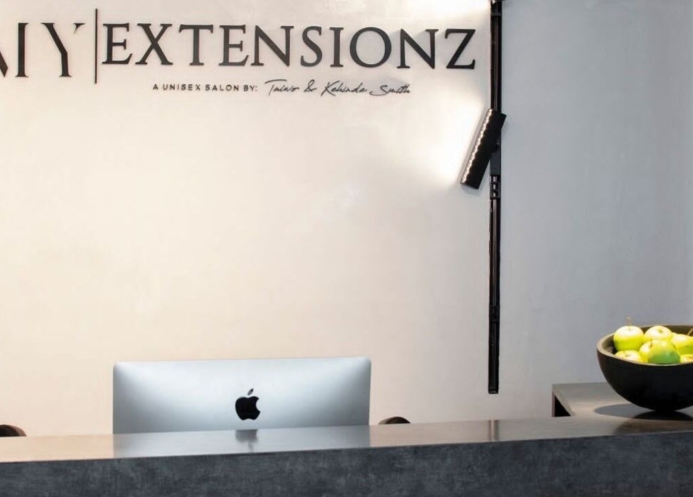 Reception area of My Extensionz in Lagos, Lagos, NG with sleek decor and a modern computer.