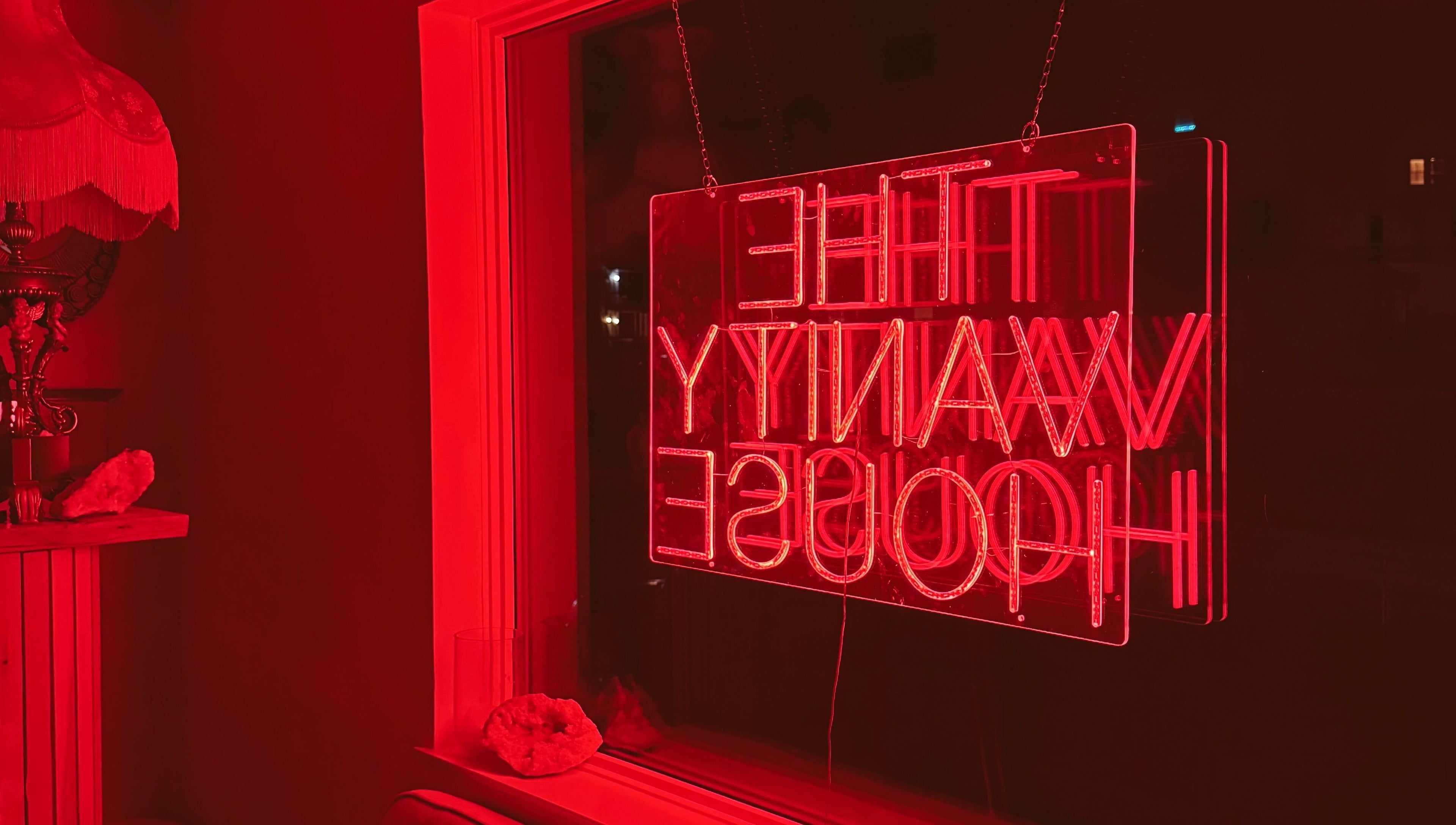 Cozy red neon ambiance at Enhance Esthetics, Baltimore, Maryland, US, highlighting a chic and inviting atmosphere.