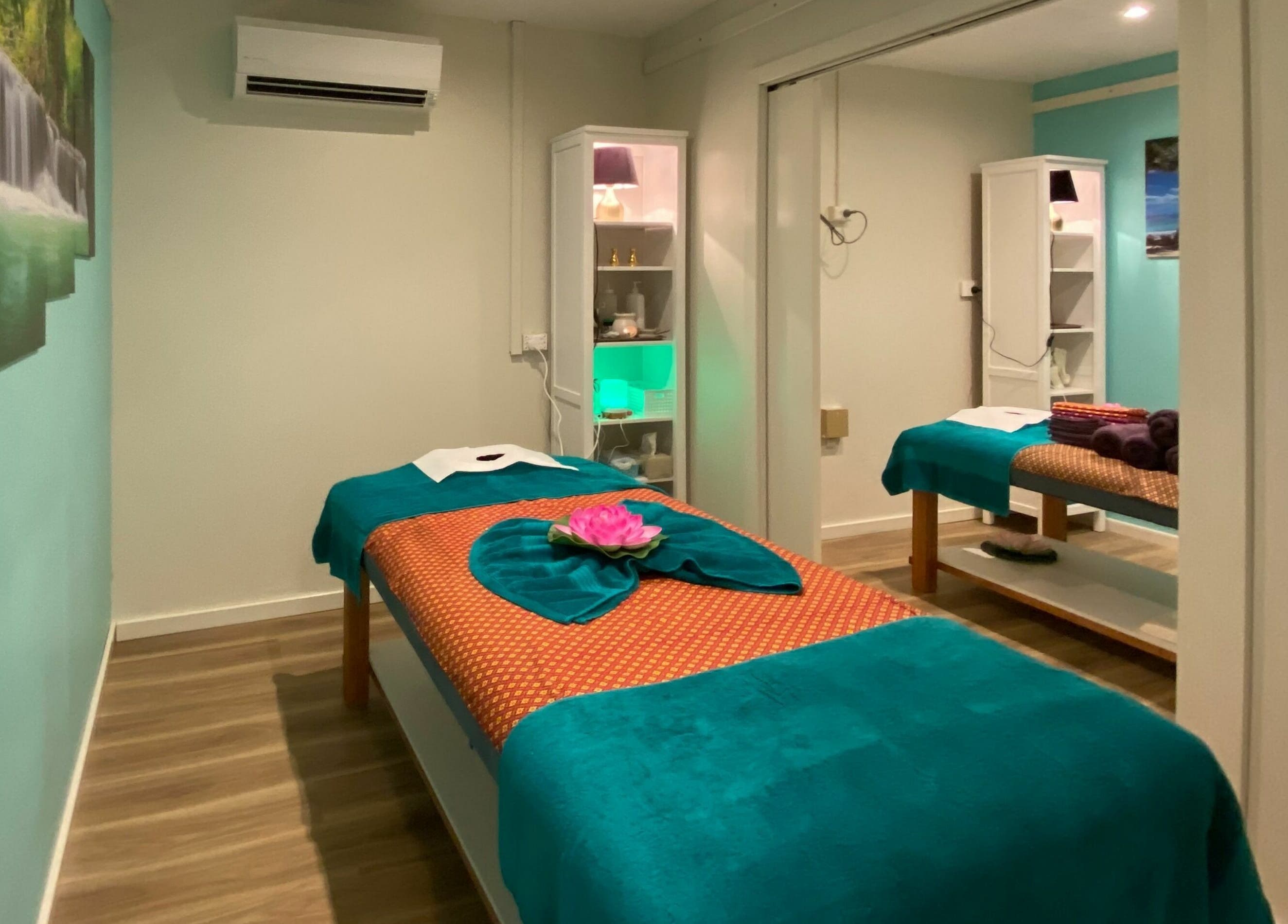 Tranquil massage room at Sawadee Cardiff, Cardiff, New South Wales, AU, with green and white decor.