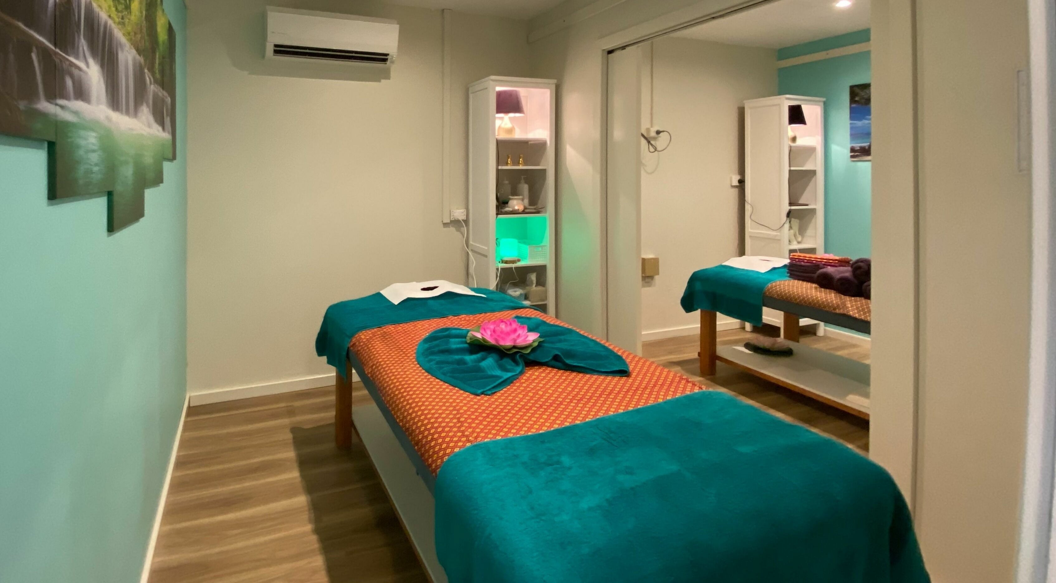 Tranquil massage room at Sawadee Cardiff, Cardiff, New South Wales, AU, with green and white decor.