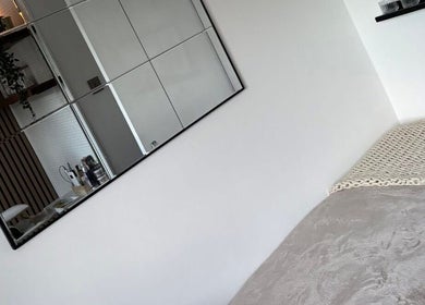 Calming treatment room with soft bedding at The Beauty Box, North Sunderland, England, GB.