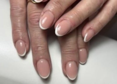 Beautiful French manicure at The Beauty Box, North Sunderland, England, GB, showcasing elegant nail art.