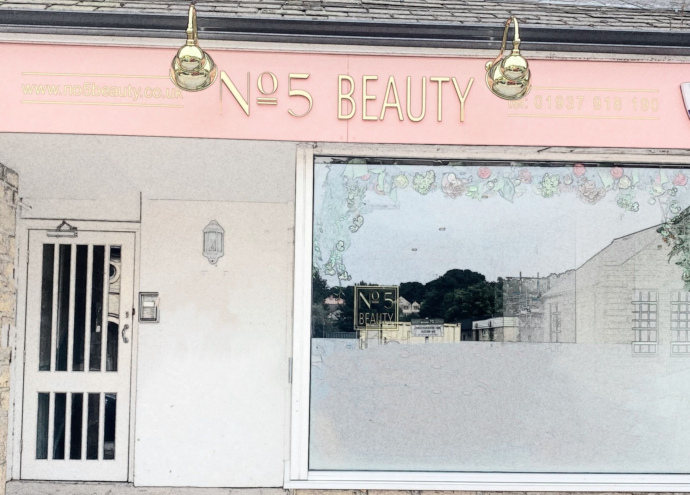 Front view of No 5 Beauty salon, Wetherby, England. Elegant glass window with floral decor.