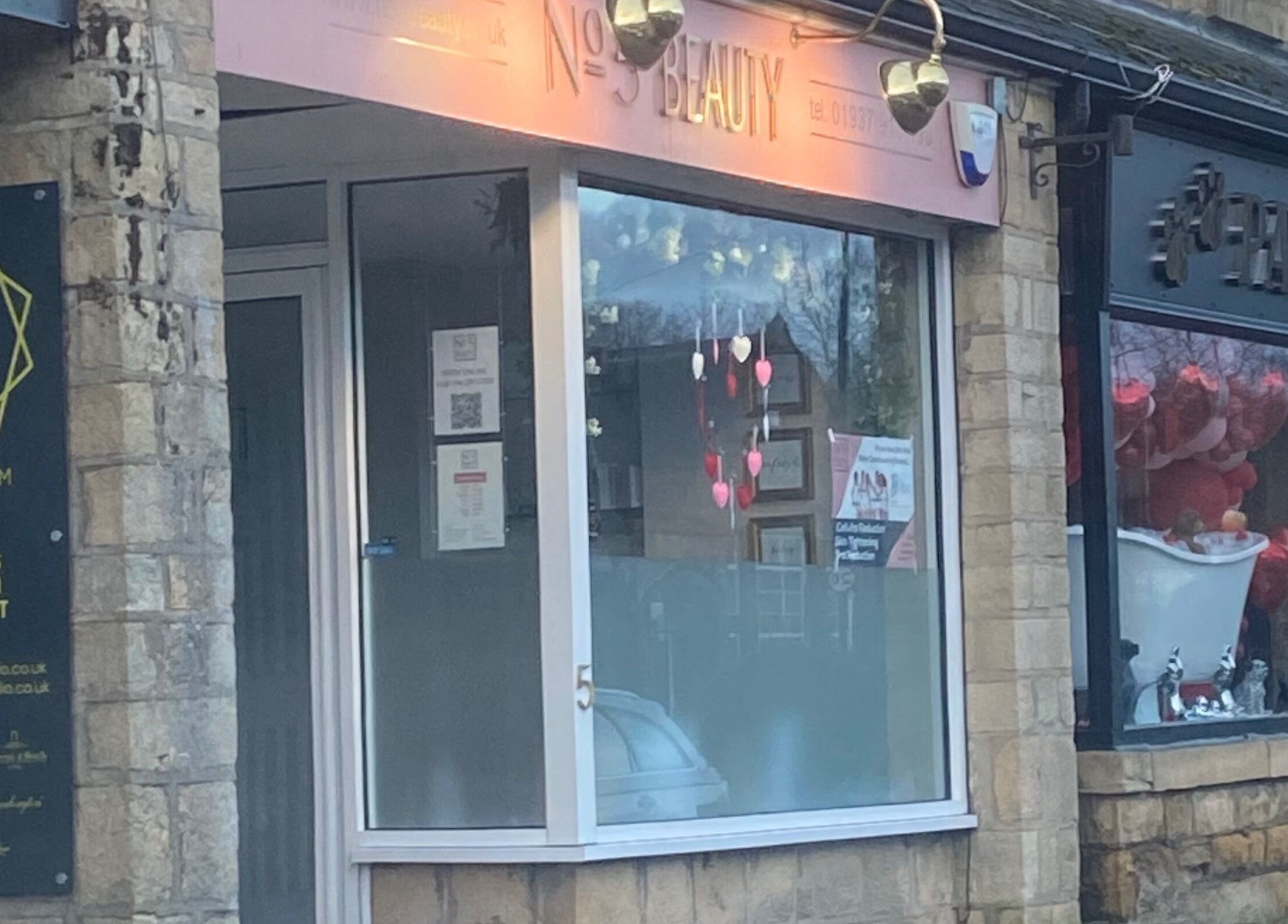 Entrance of No 5 Beauty, a serene beauty venue in Wetherby, England, GB with heart decorations.