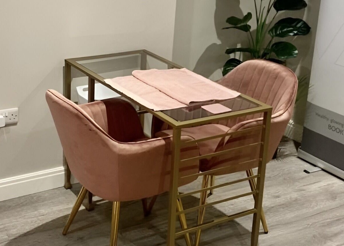 Elegant gold and pink seating area at No 5 Beauty, Wetherby, England, GB, inviting relaxation.