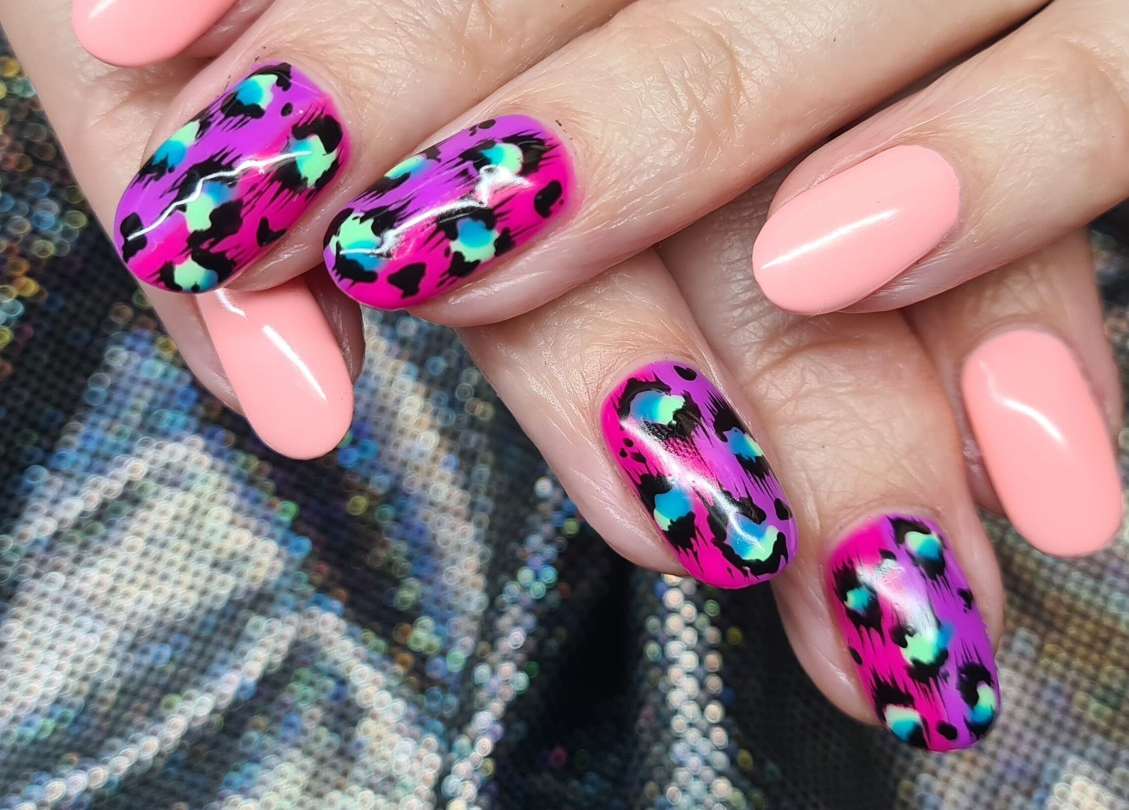 Stylish leopard print nails at The Polish Room, Taupō, Waikato, NZ, showcasing vibrant artistry.