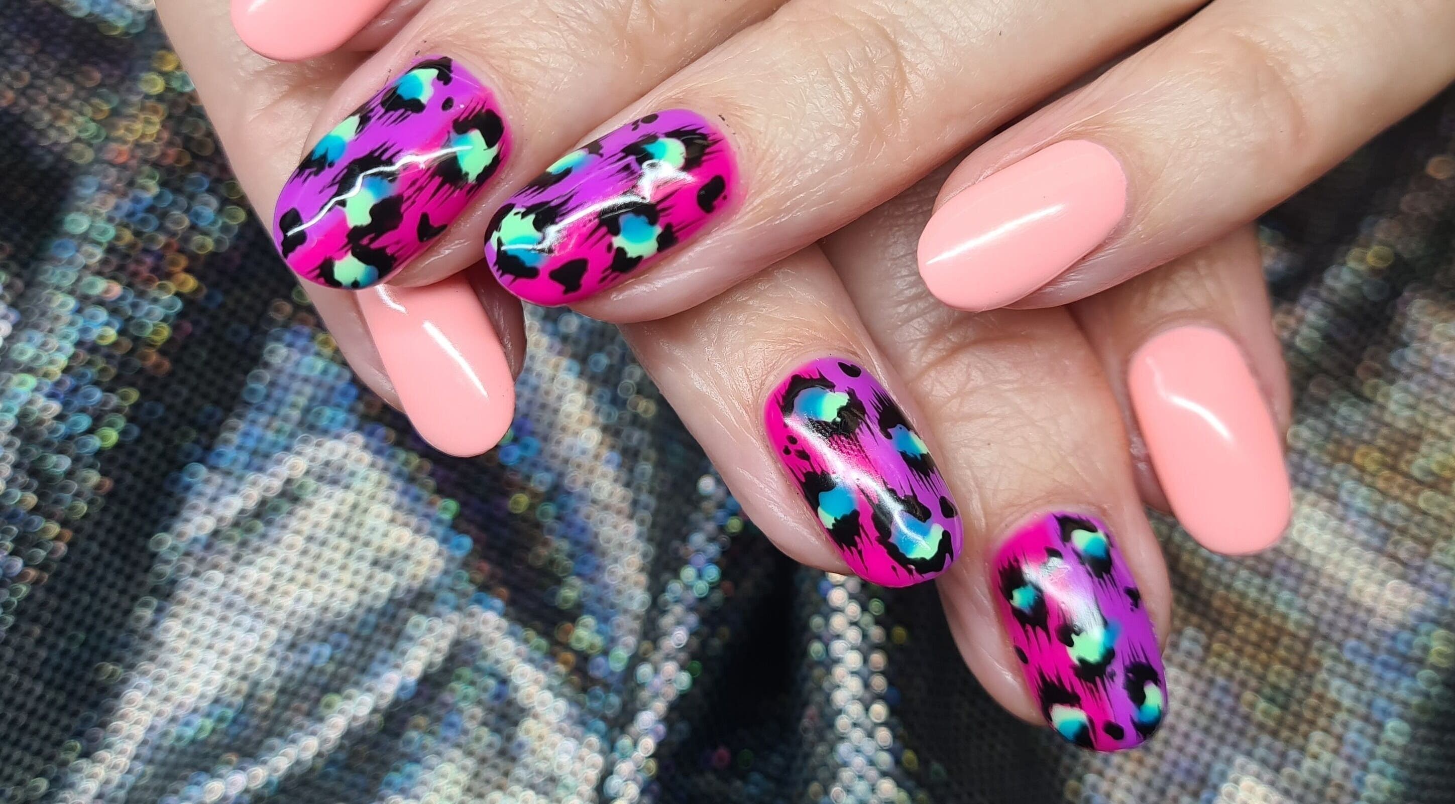 Stylish leopard print nails at The Polish Room, Taupō, Waikato, NZ, showcasing vibrant artistry.