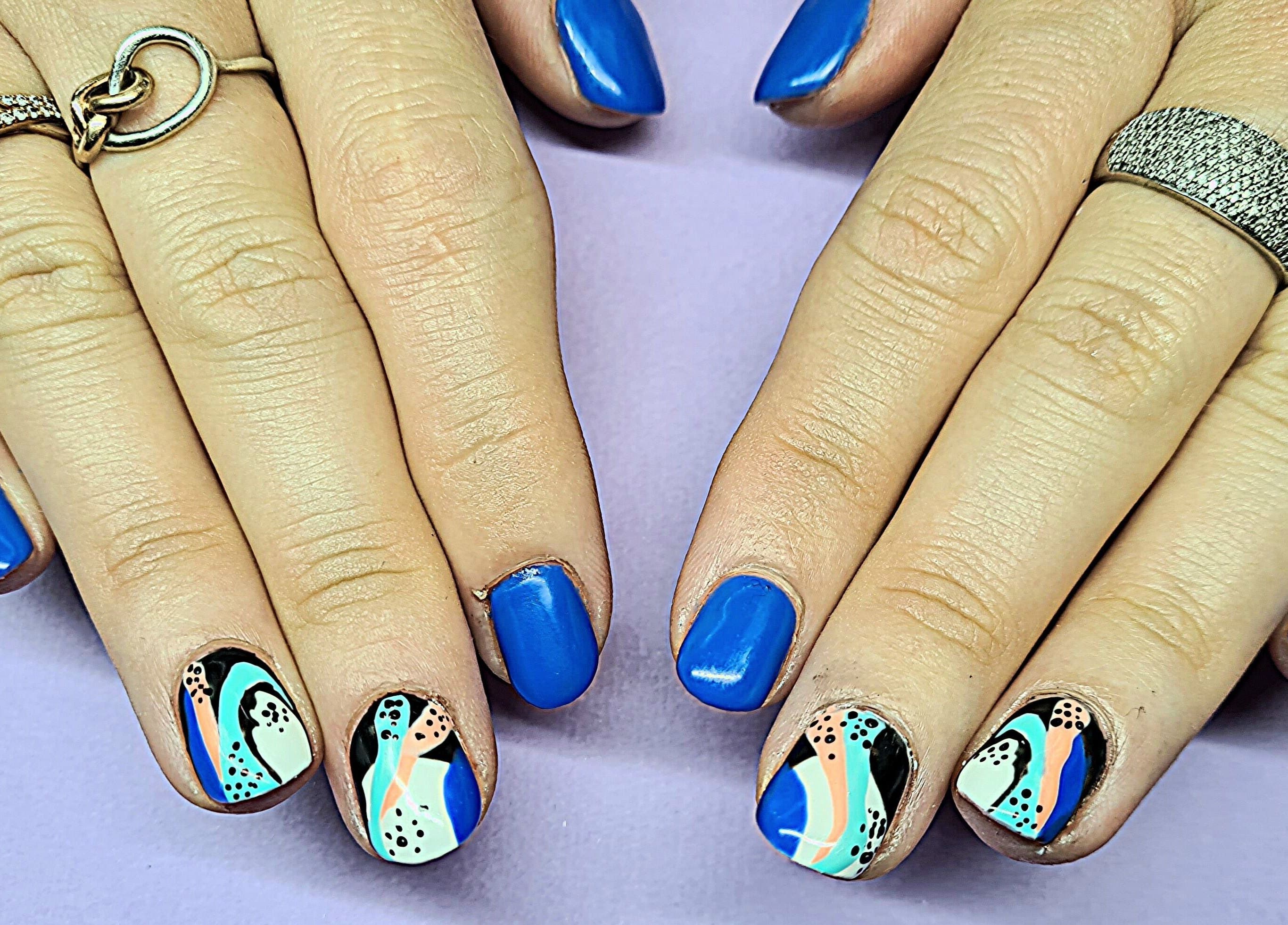 Vibrant blue and abstract nail art by The Polish Room, Taupō, Waikato, NZ. Perfect blend of elegance and style.