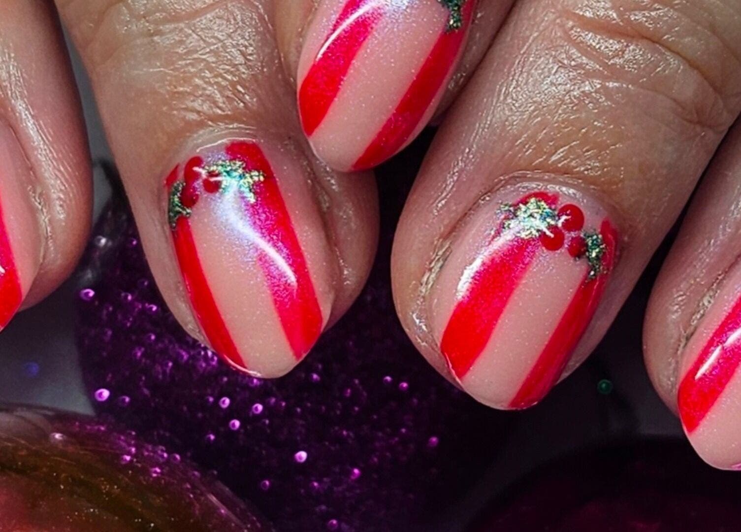 Festive red and white nail art at The Polish Room, Taupō, Waikato, NZ. Perfect for holiday flair.