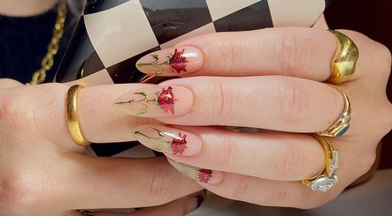 Elegant rose nail art at Ally B Nails, Aylesbury, England, GB. Perfectly manicured style for fashion-forward clients.