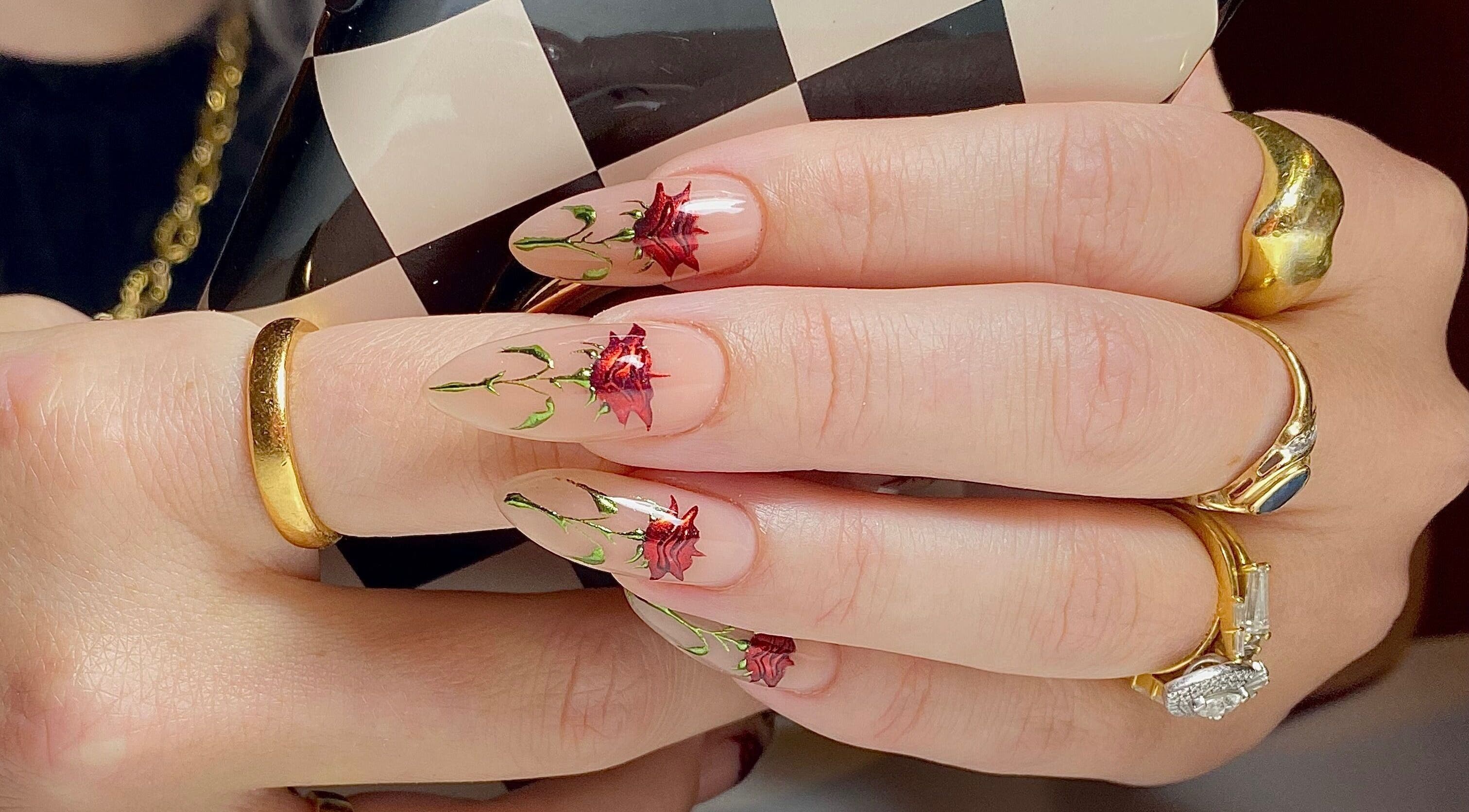 Elegant red rose nail art at Ally B Nails in Aylesbury, England, GB, showcasing intricate floral designs.