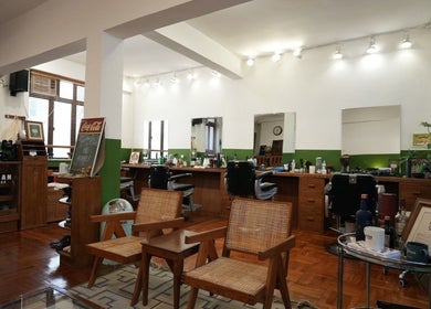 Interior of Goodman Barber Shop (Causeway Bay) featuring retro decor and barber chairs in Hong Kong Island, HK.