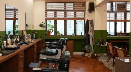 Interior of Goodman Barber Shop in Causeway Bay, Hong Kong Island, HK with classic decor and barber chairs.