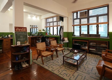 Modern interior of Goodman Barber Shop in Causeway Bay, Hong Kong Island, HK with chic decor and seating.