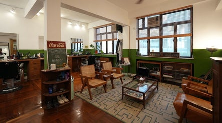 Modern interior of Goodman Barber Shop in Causeway Bay, Hong Kong Island, HK with chic decor and seating.