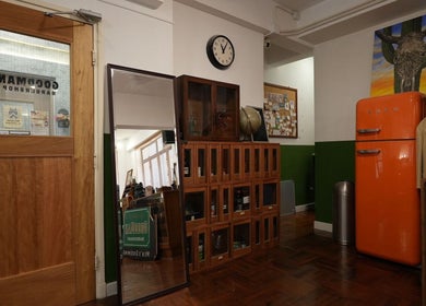 Interior of Goodman Barber Shop (Causeway Bay), cozy vintage decor with wooden cabinetry on Hong Kong Island, HK.