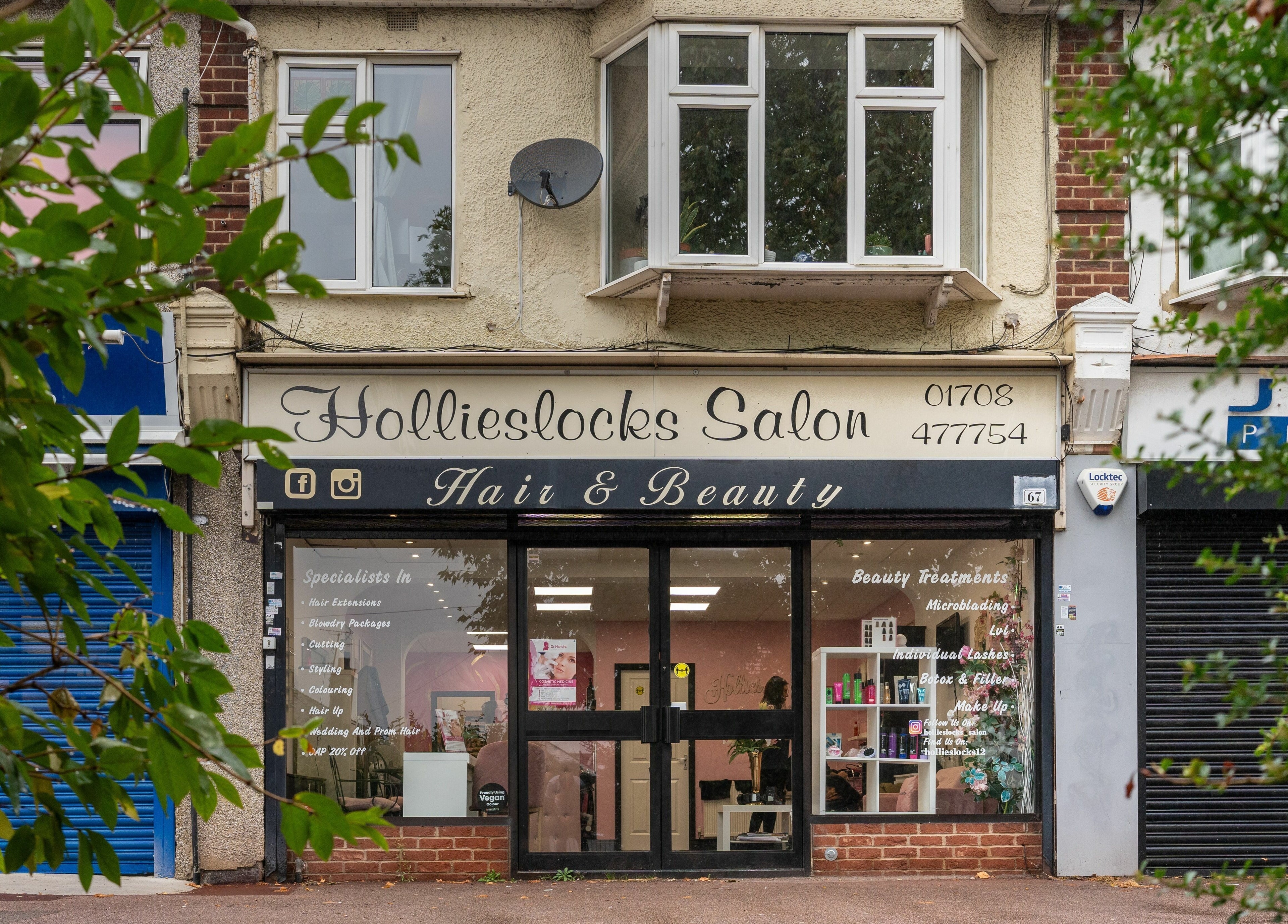 Front view of Hollieslocks Salon at Hornchurch, England, GB showcasing its elegant signage and inviting entrance.