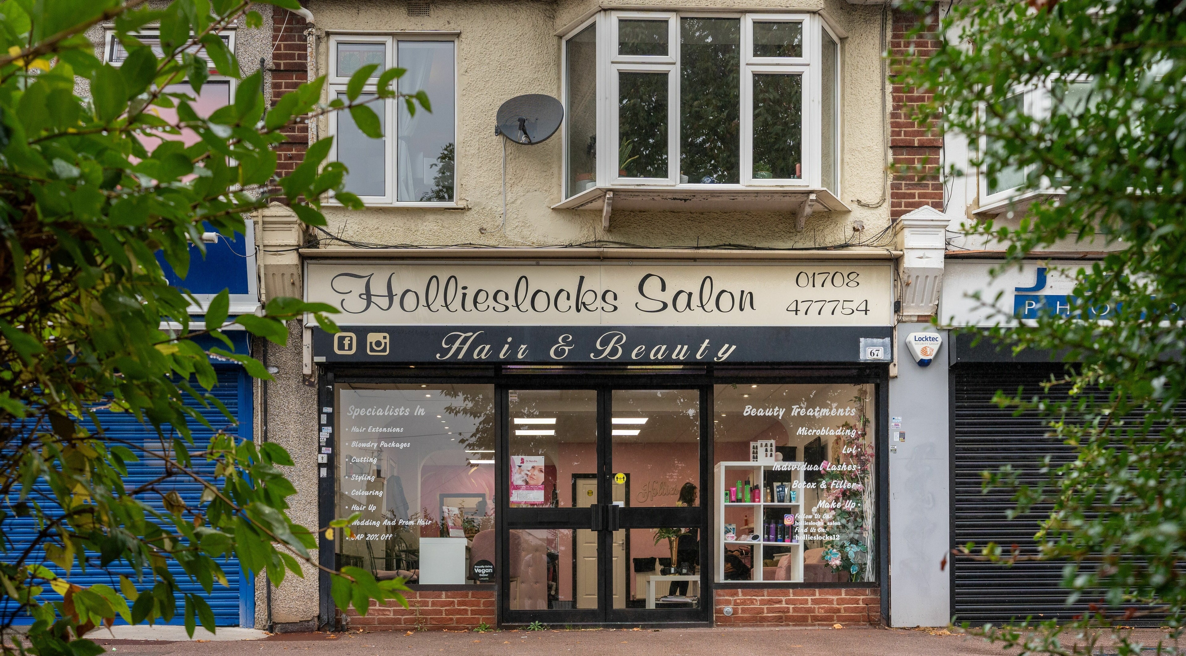Front view of Hollieslocks Salon at Hornchurch, England, GB showcasing its elegant signage and inviting entrance.