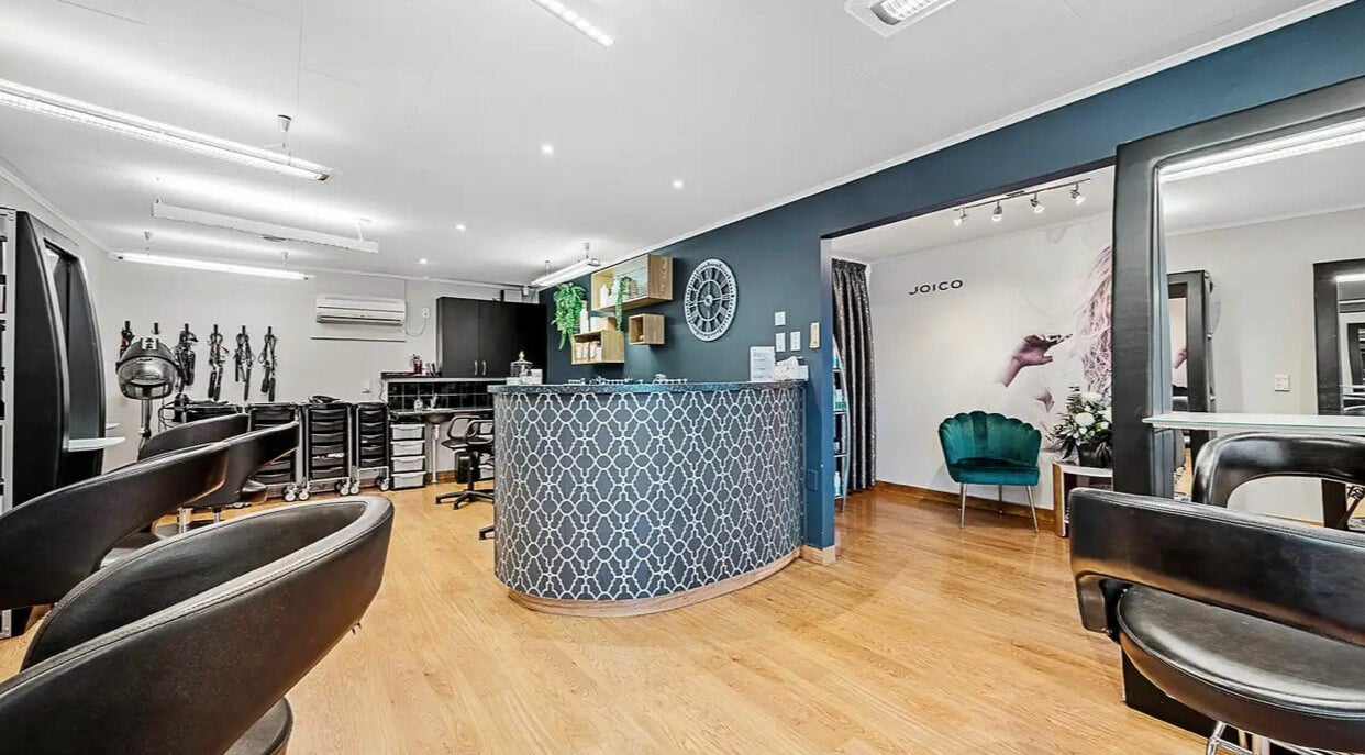 Modern and stylish interior of Hairstudio at 217 in Blenheim, Marlborough, NZ showcasing salon seating area.