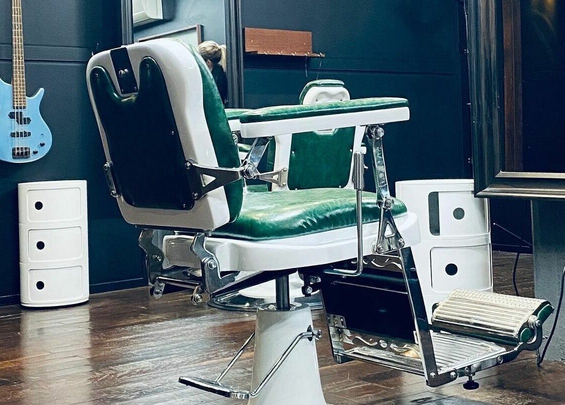 Classic barber chair at SHED Barbershop, Gladstone Central, Queensland, AU, offering a vintage aesthetic.