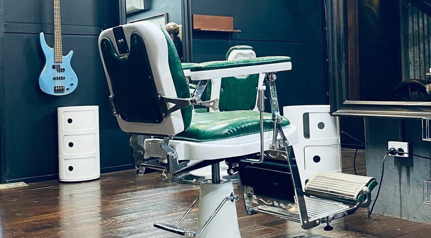 Classic barber chair at SHED Barbershop, Gladstone Central, Queensland, AU, offering a vintage aesthetic.