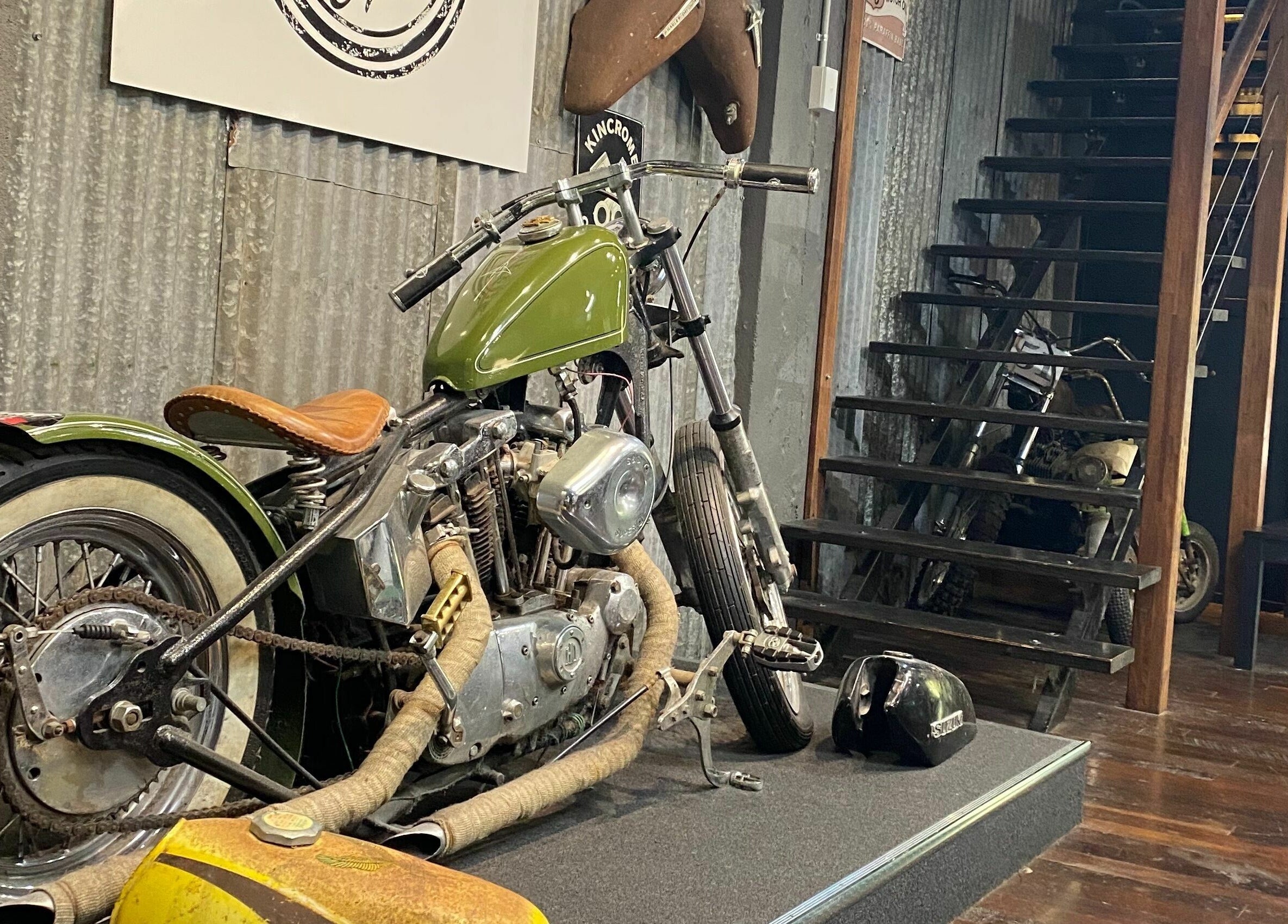 Retro motorcycle decor at SHED Barbershop, Gladstone Central, Queensland, AU enhances the venue's unique atmosphere.