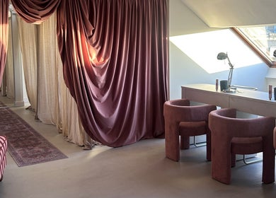 Luxurious interior of Emily Marietta Barker, Glasgow, Scotland, GB, featuring velvet drapes and modern seating.