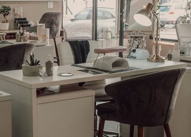 Modern nail salon setup at Base Coat Melkbos, Cape Town, Western Cape, ZA featuring cozy chairs and manicure stations.