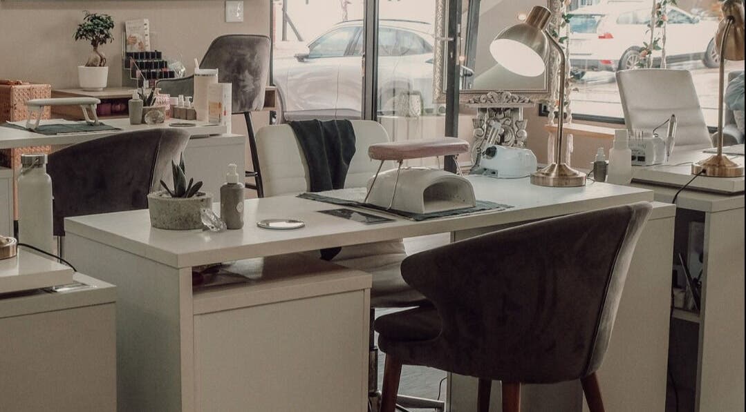 Modern nail salon setup at Base Coat Melkbos, Cape Town, Western Cape, ZA featuring cozy chairs and manicure stations.