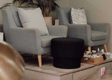 Comfortable seating area at Base Coat Melkbos in Cape Town, Western Cape, ZA offering a relaxing spa ambiance.
