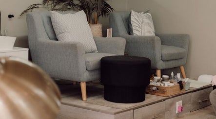 Comfortable seating area at Base Coat Melkbos in Cape Town, Western Cape, ZA offering a relaxing spa ambiance.