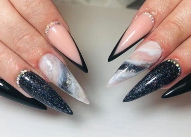Elegant nail art at Base Coat Melkbos in Cape Town, Western Cape, ZA showcasing black and pink designs.