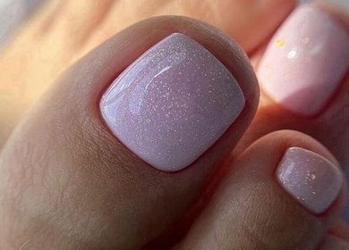 Shimmering pink pedicure at Base Coat Melkbos, Cape Town, Western Cape, ZA offering top-notch nail care.