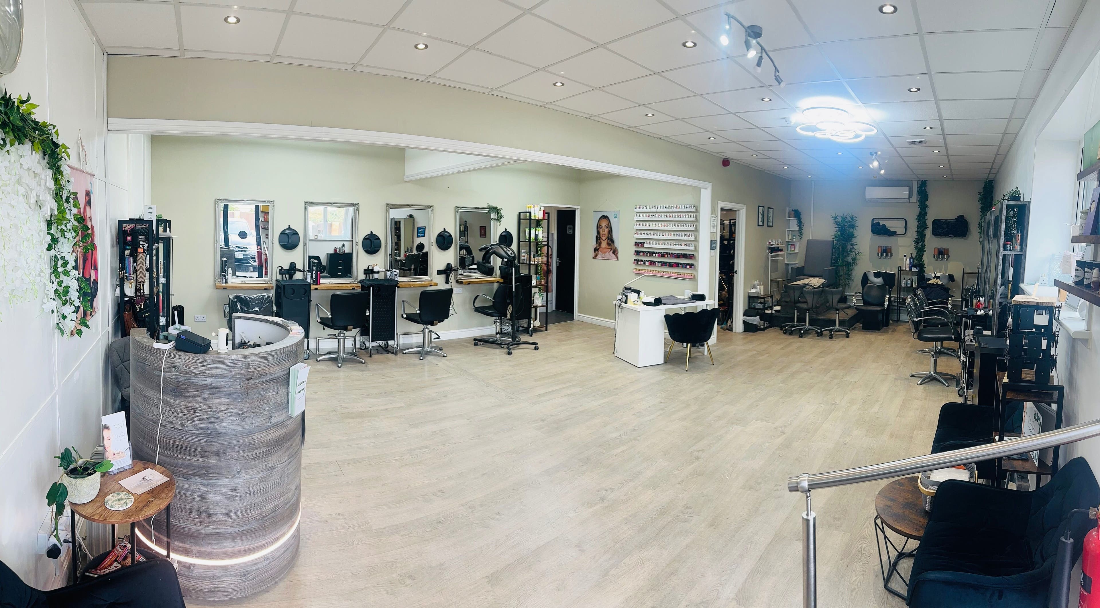 Modern salon interior at A Stroke Of Magic Hair & Beauty, Crewe, England, GB, showcasing stylish seating and decor.