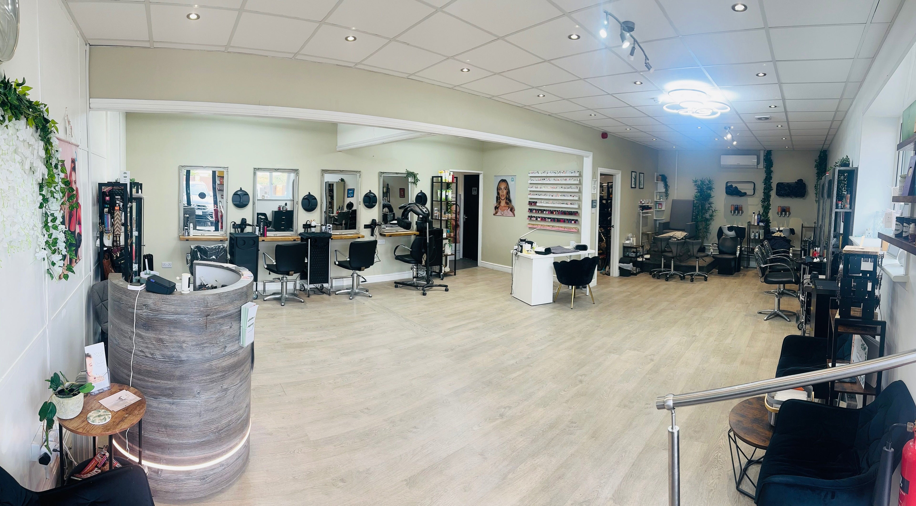 Modern salon interior at A Stroke Of Magic Hair & Beauty, Crewe, England, GB, showcasing stylish seating and decor.