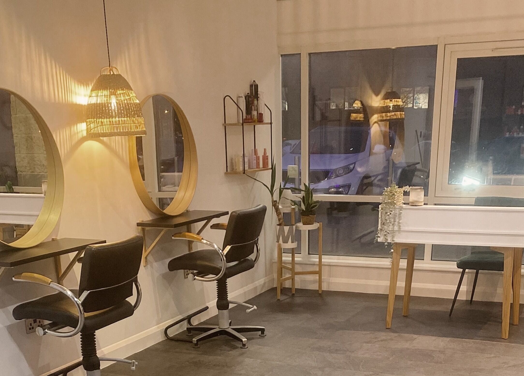 Modern salon interior at Fika Hair - Caton Road, Lancaster, England, GB, featuring stylish mirrors and seating.