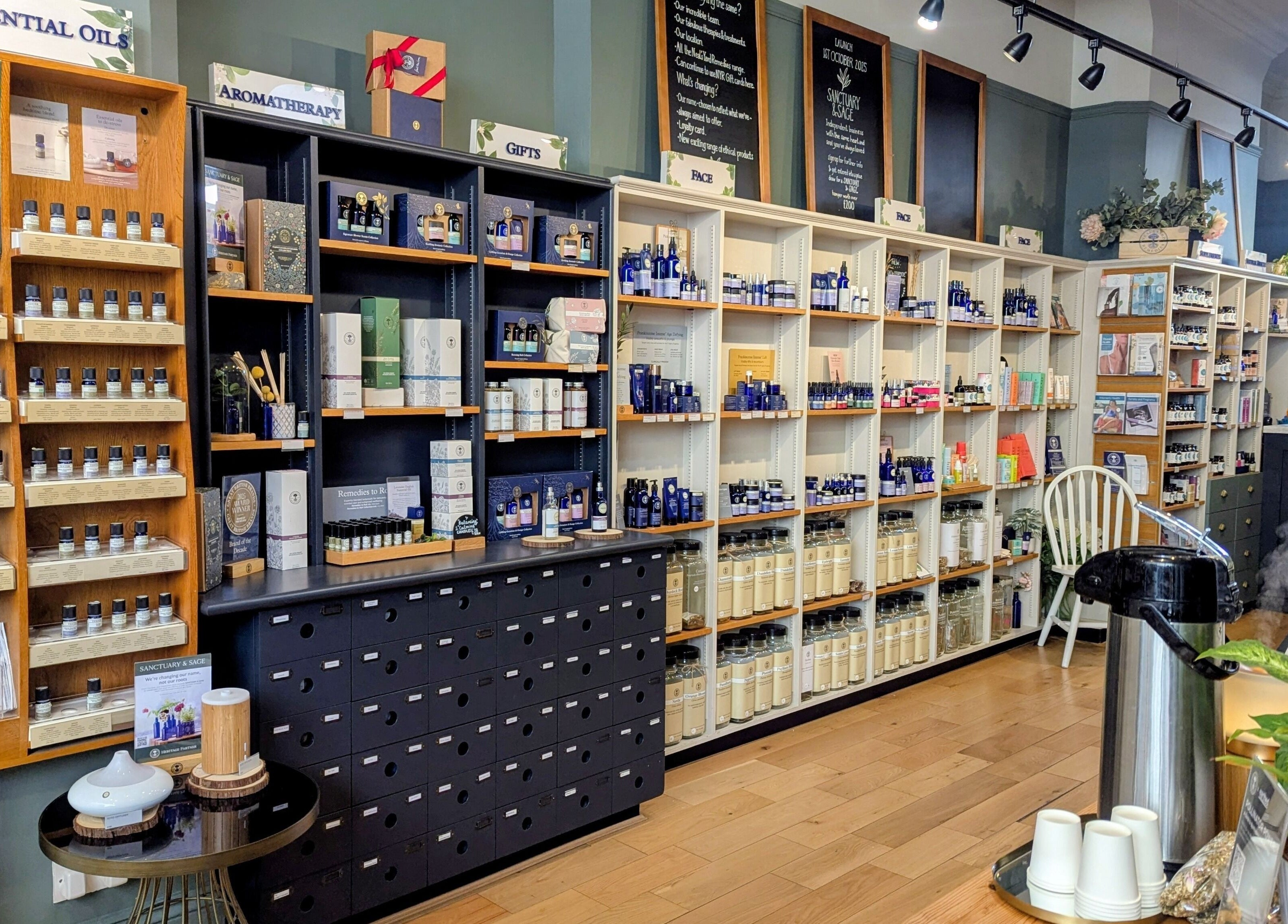 Interior of Sanctuary & Sage, Cheltenham, England, showcasing essential oils and wellness products.
