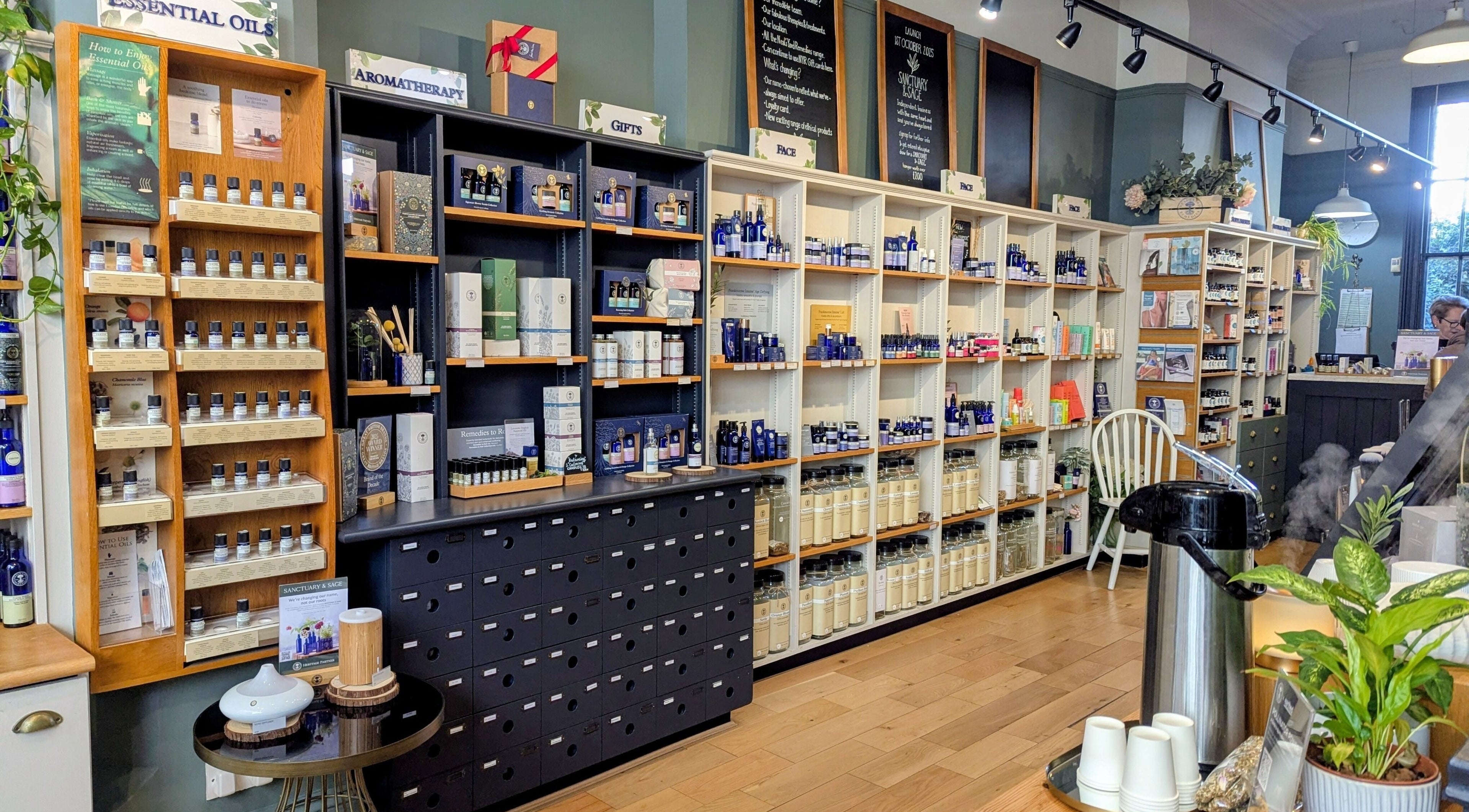 Interior of Sanctuary & Sage, Cheltenham, England, showcasing essential oils and wellness products.