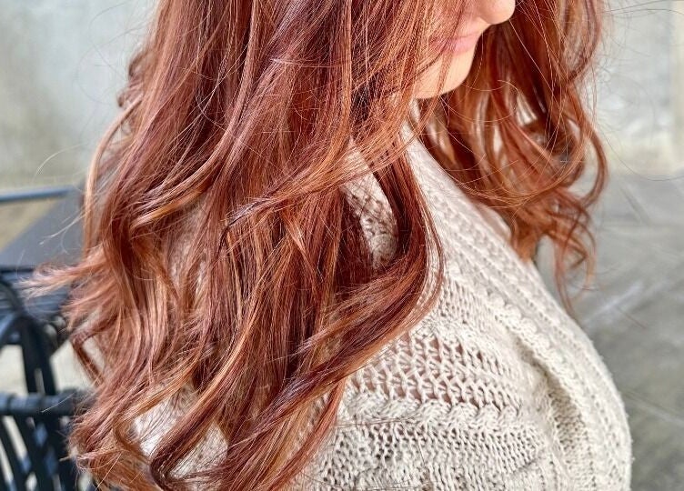 Soft copper waves styled at The Glow, Benoni, Gauteng, ZA, showcasing elegant hair artistry.