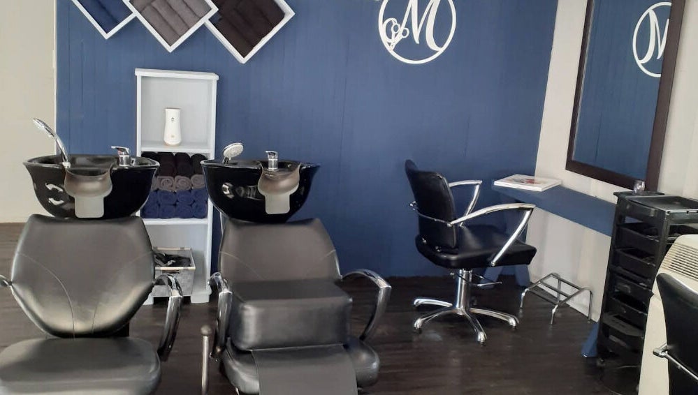 Modern salon interior at Studio M, Randburg, Gauteng, ZA with stylish wash stations and seating.