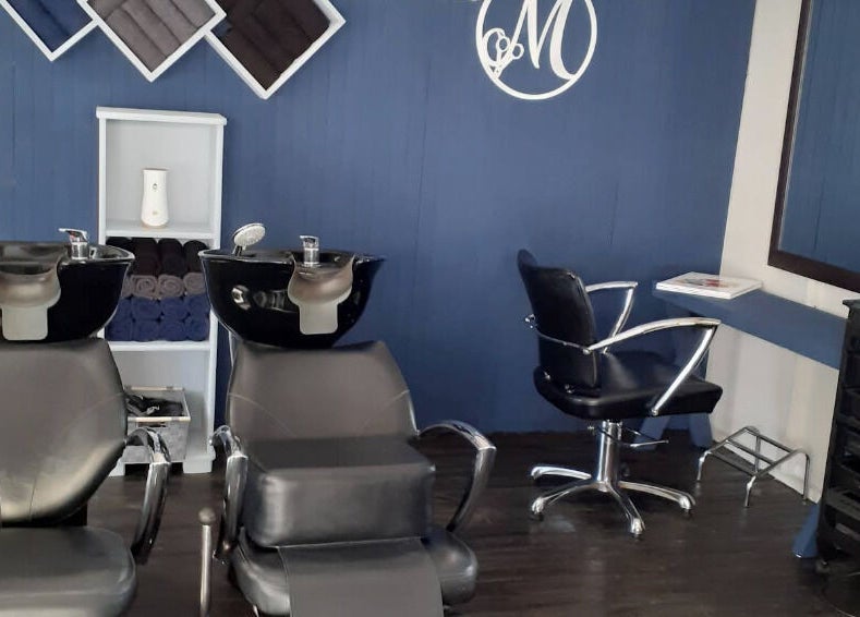 Modern salon interior at Studio M, Randburg, Gauteng, ZA with stylish wash stations and seating.