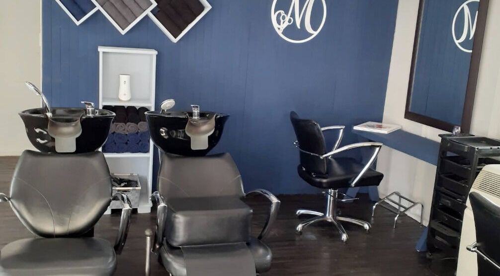 Modern salon interior at Studio M, Randburg, Gauteng, ZA with stylish wash stations and seating.