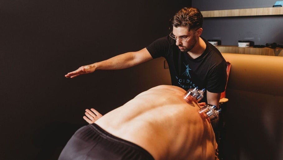 Therapist at Nordic Massage Campbell performing cupping therapy in Campbell, Australian Capital Territory, AU.