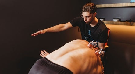 Therapist at Nordic Massage Campbell performing cupping therapy in Campbell, Australian Capital Territory, AU.