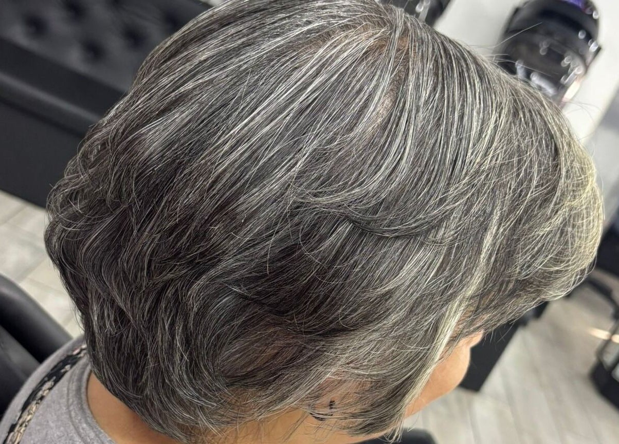 Stylish silver haircut at Alexa’s Dominican Salon in Woodbridge Township, New Jersey, US.