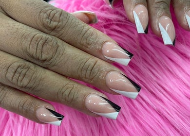 Stylish black and white nails at Alexa’s Dominican Salon, Woodbridge Township, New Jersey, US.