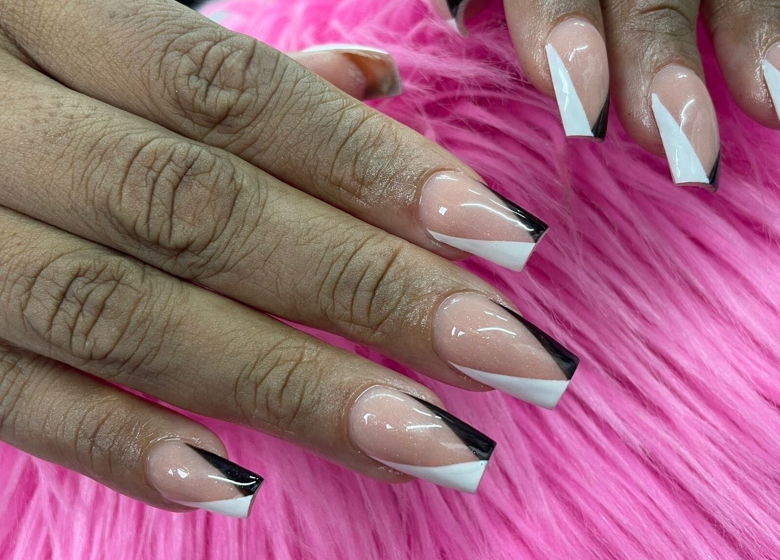 Stylish black and white nails at Alexa’s Dominican Salon, Woodbridge Township, New Jersey, US.