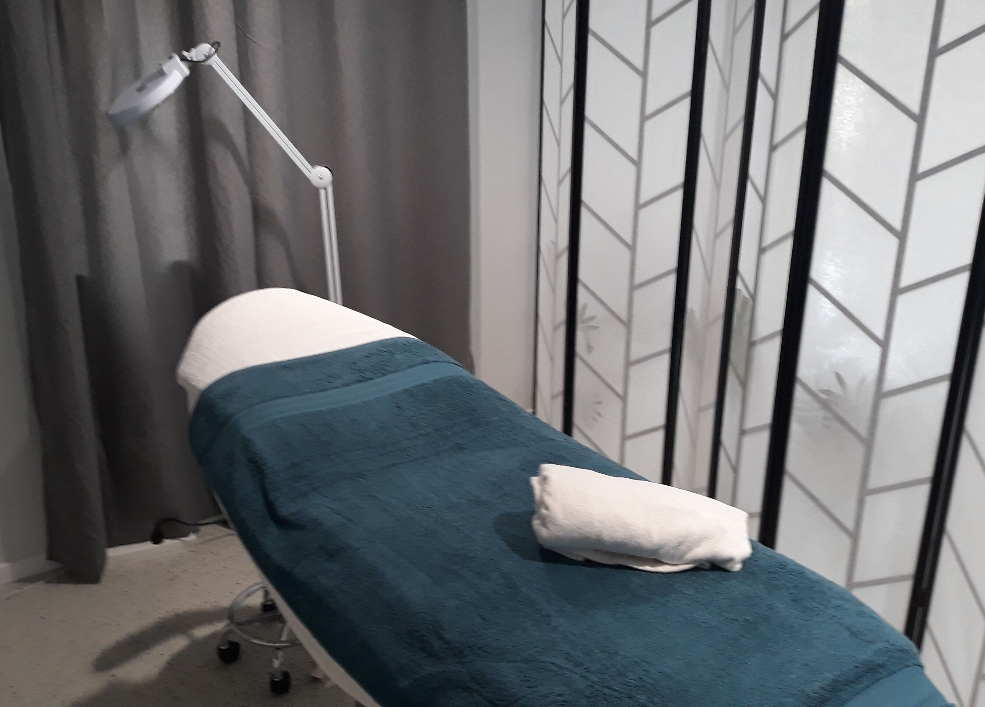 Cozy treatment room at Essential Beauty 2 U in Victory Heights, Queensland, AU with a relaxing treatment bed.